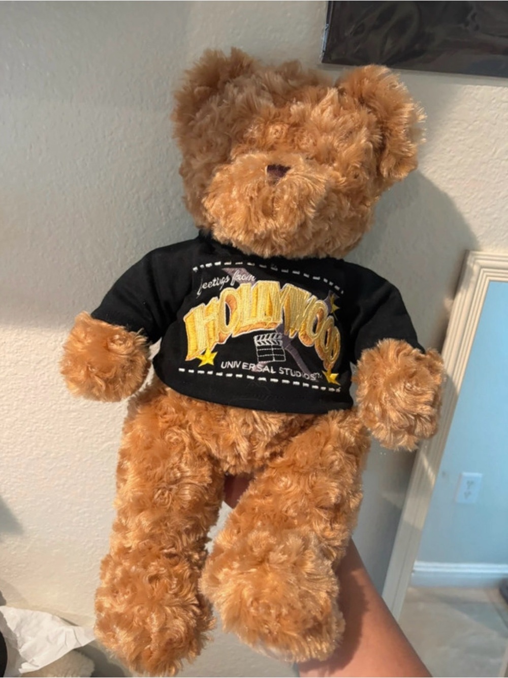 Universal Tan Plush Teddy Bear with Black Logo Shirt